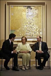Maria Altmann, center, chats with Michael Govan, left, director of the Los Angeles County Museum of Art, and her attorney E. Randol Schoenberg in front of a Gustav Klimt painting of Altmann's aunt titled "Adele Bloch-Bauer I," at the Los Angeles County Museum of Art in this April 4 file photo. The painting, looted from Altmann's family in 1938 by the Nazis, was sold to the Neue Galerie in New York for a record-setting amount.