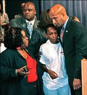 New Orleans Mayor Ray Nagin hugs Monalisa Hunter at the conclusion of a news conference at the City Council Chambers in New Orleans. Nagin asked the governor Monday to send National Guard troops to patrol his city after a violent weekend in which five teenagers were shot to death and a man was fatally stabbed in an argument over beer. Hunter lost two sons Arsenio Hunter, 16, and Marquis Hunter, 19, in the shooting. Joining Hunter and Nagin was Barbara Lacen Keller, Arsenio Hunter's godmother.