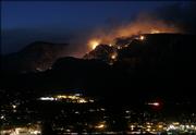 The Brin's Fire burns near Sedona, Ariz. Authorities on Monday evacuated five subdivisions in Sedona and also about 400 homes and businesses in nearby Oak Creek Canyon. The Brin's fire has burned more than 1,100 acres so far.