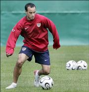 Team USA midfielder Landon Donovan dribbles the ball during a training session. Donovan has shown two sides to his game during the 2006 World Cup - lacking aggressiveness in the opener against the Czech Republic while rebounding to play an intense game Saturday against Italy. The big question for the U.S. is how he performs Thursday in a must-win game against Ghana.