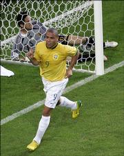 Brazil's Ronaldo celebrates a goal as Japan goaltender Yoshikatsu Kawagushi stays in the net. Brazil won, 4-1, Thursday in Dortmund, Germany.