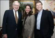 Warren Buffett, left, Melinda Gates and Bill Gates stand together on Sunday in New York, shortly after Buffett's announcement that he would begin making an annual donation to the Bill and Melinda Gates Foundation.