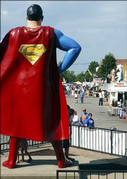 Steve Jahnke/AP PhotoA 15-foot bronze statue of the comic-book hero overlooks Superman Square in Metropolis, Ill., during Wednesday's annual Superman Celebration.