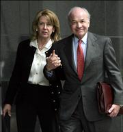 Enron founder Kenneth Lay and his wife, Linda, return to the federal courthouse after lunch in week 10 of his fraud and conspiracy trial in this April 4 photo in Houston. Lay, who was convicted of helping perpetuate one of the most sprawling business frauds in U.S. history, died Wednesday of a heart attack in Colorado. He was 64.