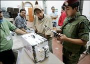 A Mexican soldier keeps inventory of the ballot boxes that leave a secure area for the final count of the presidential election in Mexico City. The official recount began Wednesday.