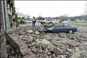 A brick wall at the Clinton Place Apartments, 2125 Clinton Parkway, collapsed and damaged a car during the March 12 microburst. The storm caused damage to property throughout Lawrence.