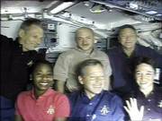 astronaut Lisa Nowak, front right ,waves after the crew gathered on Discovery's flight deck for interviews with various news organizations on Sunday in this photo from NASA television. The crew are, front row from left, astronaut Stephanie Wilson, commander Steve Lindsey and astronaut Lisa Nowak, and back row from left, astronaut Piers Sellers, pilot Mark Kelly and astronaut Mike Fossum.