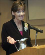 Jodi Carlson, Clinical Coordinator of the Breast Center at Lawrence Memorial Hospital, accepts the 2006 Wellspring Professional Award for her work in the fight against breast cancer. Carlson received the honor Saturday at the ninth annual Betsy Beisecker Breast Cancer Awareness Tea at Lawrence Memorial Hospital.