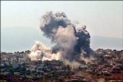 Black smoke billows in the town of Khiam, in southern Lebanon, after Israeli air raids targeted it Saturday. Israel also struck the southern village of Kafra, killing two people and wounding four others.
