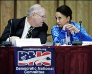 James Roosevelt Jr., left, and Alexis Herman, right, Democratic National Committee Rules and Bylaws Committee co-chairs, confer during the committee's Saturday meeting in Washington to draft the party's 2008 delegate selection rules and the call for the 2008 Democratic National Convention.