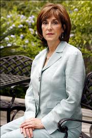 Dr. Anna Pou poses for a photograph Saturday at her home in New Orleans. Pou and two nurses, Cheri Landry and Lori Budo, were arrested Monday and accused of being principals to second-degree murder in the deaths of four patients at Memorial Medical Center three days after Katrina hit. Formal charges will be up to the New Orleans prosecutor.
