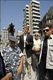 Jan Egeland, center, the United Nations' top humanitarian official, inspects the destruction wrought by Israeli air raids on south Beirut, Lebanon. Egeland on Sunday announced that the world body would begin a major relief operation in the next few days.