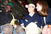 Bill and Melinda Gates sit with tuberculosis patient Nkosebaca Thingathinga in Khayelitsha, South Africa. Their foundation gave him money but not a new house. As the Gateses become more involved in philanthropic work they are refining their approach to charitable giving and discovering the limits of what money can do.