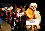 Santas from the United States, Japan, Norway and Sweden line up backstage before making their entrance at a convention in Copenhagen, Denmark. Six months ahead of Christmas, more than 150 Santas gathered in Denmark for the annual World Santa Claus Congress.