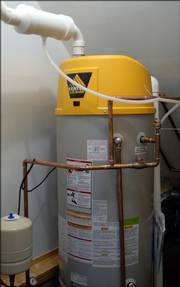 The home is heated by hot water tubes running through the floors and controlled by this high-efficiency water heater.
