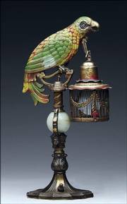 This unusual bronze parrot-shaped table lamp holds a lantern with an electric light bulb inside. The 15 1/4-inch lamp attracted a buyer who spent $518 for it at a James Julia auction in Fairfield, Maine.