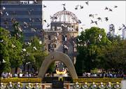 Doves fly by the Atomic Bomb Dome on Sunday during the ceremony to mark the 61st anniversary of the world's first atomic bombing at Hiroshima Peace Memorial Park in Hiroshima, Japan.