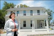 Diana Robertson, interim housing director of Kansas University, visits the new Crawford Community Center at 1346 La. The site will serve as meeting space for KU's scholarship hall students.
