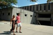 Students pass Wescoe Hall on the Kansas University campus. A study on possible health risks in the building found no significant hazards but did point to problems with airflow. Additional tests will be performed in upcoming weeks.