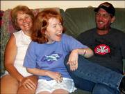Tina, left, and Rodney Breeze sit with their daughter, Dannielle, recently at their home in Burlington. Dannielle was born with cerebral palsy and was recently diagnosed with axonal and demyelinating neuropathy. Doctors do not know how much time she has to live.