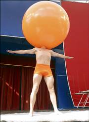 Lars Lottrup stands with his head in a balloon Thursday at the International Clown Festival in Copenhagen, Denmark. Clowns from a number of countries around the world have convened in Denmark for the festival.