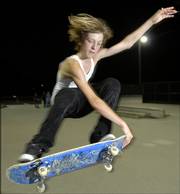 Lawrence skater Addison Toelkes, 14, goes airborne on one of the ramps at the park, southeast of Sixth Street and Rockledge Road.