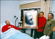 In this photo released by Cuba's Communist daily newspaper Granma, Fidel Castro, left, meets with Venezuela's President Hugo Chavez, center and interim President Raul Castro in Havana. Chavez visited on Sunday, Fidel Castro's 80th birthday.