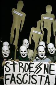 Paraguayan youths wearing masks shout slogans against the late Gen. Alfredo Stroessner at Democracy Square in Asuncion, Paraguay. Stroessner, the anti-communist general who ruled Paraguay from 1954 until 1989, died Wednesday at age 93.