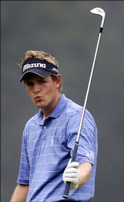 Second-round PGA Championship co-leader Luke Donald reacts after missing a birdie putt on the No. 9 hole. Donald, Henrik Stenson, Billy Andrade and Tim Herron shared the lead at 136 Friday in Medinah, Ill.