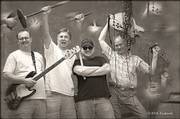 The 2006 Embarrassment reunion features band members Ron Klaus, left, John Nichols, Brent "Woody" Giessmann and Bill Goffrier. The quartet will take the stage for the first time since 1989.