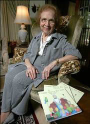 Laura Lipari sits with copies of her first book, "Gramma Shares Her Faith," in her Shaker Heights, Ohio, home. The 92-year-old great-grandmother has begun a writing career with the publication of a children's book that tells the story of Adam and Eve in question-and-answer style.