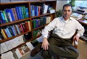 Dr. Robert Lanza, of Clinton, Mass., vice president of medical and scientific development at Advanced Cell Technology, poses in his office at the company's headquarters in Worcester, Mass., in this 2004 file photo. The company has developed a new way of creating stem cells without destroying human embryos, billing it as a potential solution to a political and ethical debate.