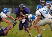 Haskell Indian Nations University's Bubba Wills tries to break through the Peru State (Neb.) defense during the Fightin' Indians' 2006 opener. HINU lost Saturday's contest, 27-6, at Haskell Stadium.
