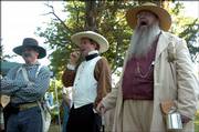 Historical re-enactors, from left, John Nichols, Tim Rues and Edward Hoover took part in the sesquicentennial commemoration of the Battle of Black Jack at the site near Baldwin earlier this year. This week, historians from across the nation will tour Bleeding Kansas-era sites including Black Jack Battlefield.