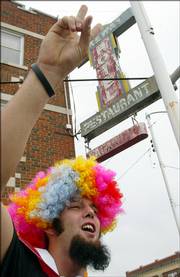 Dennis Russell, of Altoona, yells toward picketers from the Westboro Baptist Church as he stands outside the Lakeway Hotel Sunday in Meade.