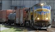 A Union Pacific freight train passes through North Lawrence on Tuesday. Trains and trucks are beginning to carry more ethanol, which is flammable. Training is scheduled for 10 Kansas communities to help local emergency personnel prepare for a possible ethanol accident.