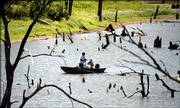 Two fishermen spend time on the Wakarusa arm of Clinton Lake, an area managed by the Kansas Department of Wildlife and Parks.