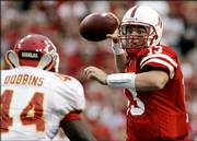 Nebraska quarterback Zac Taylor (13) throws against Iowa State's Tim Dobbins, left, in this file photo from last October. NU went 8-4 last season and closed with three straight victories.