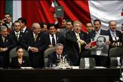 Opposition lawmakers pack the stage of Congress moments before the scheduled arrival of Mexican President Vicente Fox. The lawmakers are aligned with the Party of Democratic Revolution and its candidate, Andres Manuel Lopez Obrador, who is demanding a full recount of the July 2 presidential election results. They prevented Fox from delivering his final "state of the nation" address Friday.