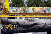 A wooden crocodile holds flowers from well-wishers outside Australia Zoo at Beerwah, home of international media personality and environmentalist Steve Irwin, who died Monday on the Great Barrier Reef in far north Queensland, Australia. Irwin, known as The Crocodile Hunter, was killed by a stingray barb to his heart while fiming a new television series.