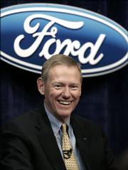 Alan Mulally is all smiles after being announced Tuesday as Ford Motor Co.'s new CEO during a news conference in Dearborn, Mich. Mulally replaces Bill Ford, who will remain chairman of the company founded by his great-grandfather. The change comes more than seven months into a restructuring, which is the second under Ford's watch and has so far failed to revive the nation's No. 2 automaker.