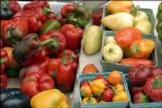 A late summer harvest of peppers awaits sale at the Lawrence Farmers Market. Vegetable garden treats can continue long into fall if preparations are made now to plant spinach, kale, garlic and more.