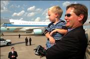 President Bush's visit was a special occasion for Will, 2, and Bryan Hedges of Lawrence, who were able to watch Air Force One's arrival and departure and tour the plane. Bryan Hedges' sister-in-law, Sarah Penny, is an aide at the White House.