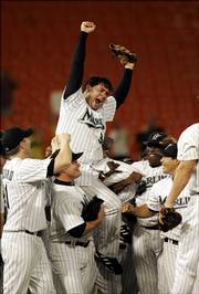 Florida pitcher Anibal Sanchez is hoisted atop his teammates' shoulders as they celebrate his no-hitter. Sanchez held the Arizona Diamondback hitless Wednesday in Miami.