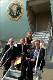 The Penny family, all of lawrence, Bill Penny, left, and wife Marlene pose with their daughter, Laura Hedges, top, and her husband, Bryan, right, and their children, Will and Faith, before touring Air Force One on Friday in Kansas City, Mo.