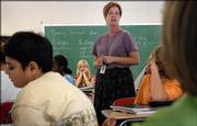 Deena Burnett, an English teacher at West Junior High School, instructs a class of eighth-graders on how to best write a memoir about something important in their life. The Kansas Public Employees Retirement System, which administers retirement plans for state and local public employees, is in need of additional funding. Currently there is a gap between the value of KPERS' assets and its future obligations to provide pensions to thousands of employees like Burnett.