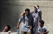 An Iraq family grieves upon arriving at a hospital morgue in Baghdad, Iraq, to claim a body of a relative. Police on Wednesday said they found the bodies of 65 men who had been tortured and then shot before being dumped around Baghdad.