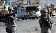 U.S. soldiers stand guard near a vehicle destroyed by a suspected suicide attacker near Kabul, Afghanistan. A youth carrying explosives jumped in front of a U.S. military convoy east of Kabul, killing a bystander and wounding three American soldiers on Sunday, Afghan police officials said.