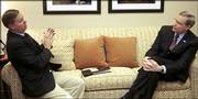 Sen. Lindsey Graham, R-S.C., left, talks with national security adviser Stephen Hadley before their separate appearances on CBS&squot; "Face the Nation" in Washington, D.C. Graham is an opponent of President Bush&squot;s plan to redefine rules for CIA interrogations.