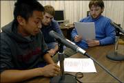 During a character voice recording session for "Zook Mayhem and the Bandits" at Wescoe Hall, Kansas University senior Nolan Jones, Pittsburg, center, listens as sophomore Jose Artiaga, St. Louis, left, and senior Chris Moodi, Pittsburg, practice their lines